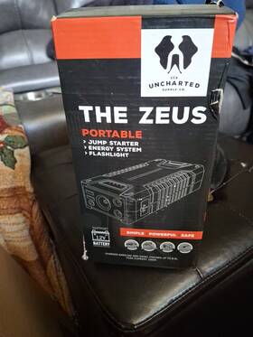 Uncharted Supply Co. 850016772244 The Zeus Jump Starter. Potable Energy System Flashlight Dc Output Dual Usbs